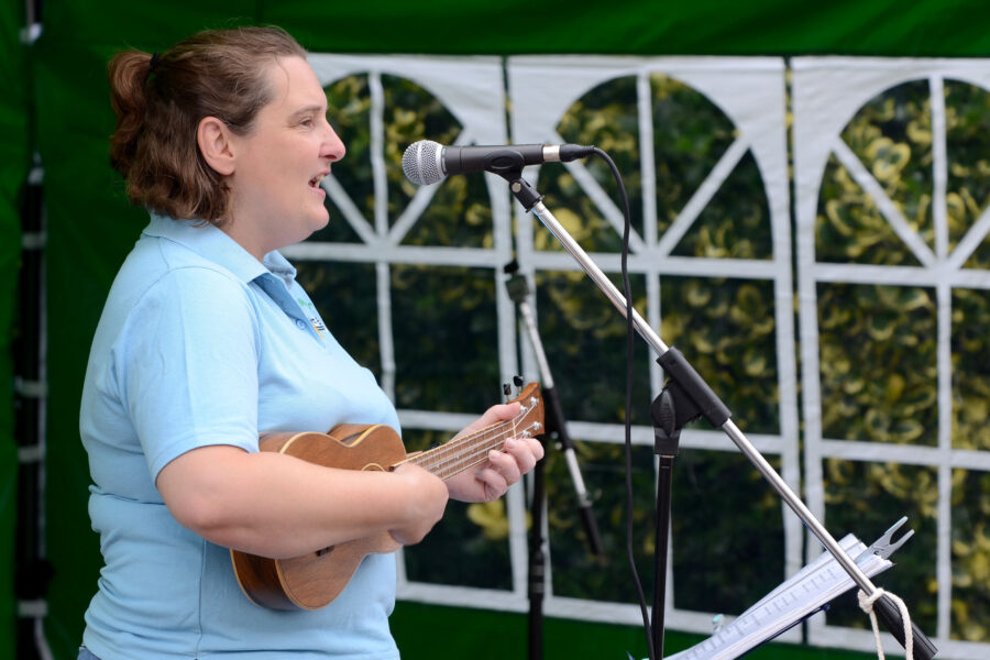 Emily Miller performing at New Street Corner on Honiton Market Charter Day 2025