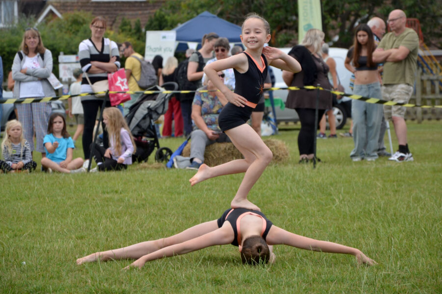 Honiton Gymnastics Club performing in the arena on Allhallows Field on Honiton Market Charter Day 2025