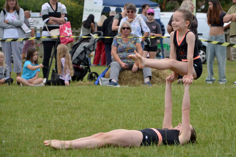 Honiton Gymnastics Club performing in the arena on Allhallows Field on Honiton Market Charter Day 2025