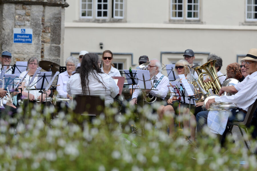 Honiton Training Band performing outside St Paul's Church on Honiton Market Charter Day 2025