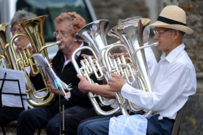 Honiton Training Band performing outside St Paul's Church on Honiton Market Charter Day 2025