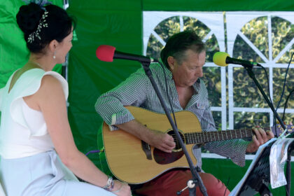 Steve Waters and Alex Oakes performing on New Street Corner at Honiton Market Charter Day 2025