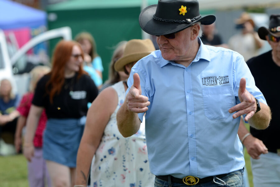Western Spirit Line Dance Club performing on Allhallows Field at Honiton Market Charter Day 2025.